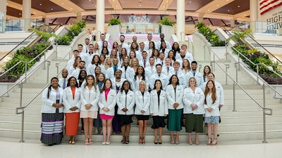 High Point University’s Workman School of Dental Medicine held its first white coat ceremony for its inaugural class of 60 students inside the Nido and Mariana Qubein Arena and Conference Center. Image and caption courtesy of High Point University.