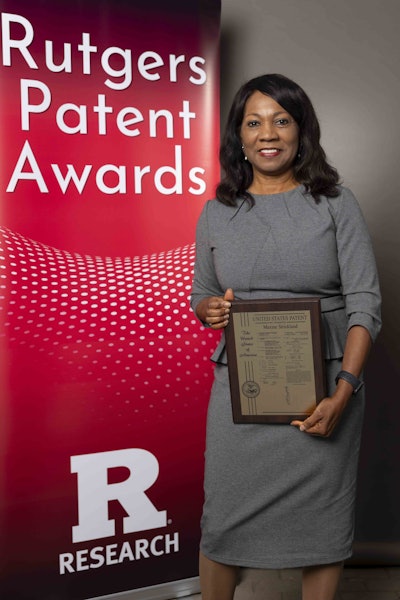 Maxine Strickland, an associate professor of diagnostic sciences, with her patent plaque at the inaugural 2024 Rutgers Innovation Awards event to celebrate Rutgers patent awardees who translate world-class research into inventions benefiting the society. Image and caption courtesy of Rutgers, The State University of New Jersey.
