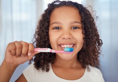 Girl Brushing Teeth