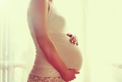 Pregnant Women Touching Belly