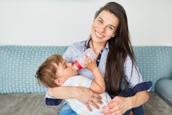 Bottle Feed Toddler Robert Kneschke