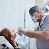 Woman Tooth Extraction Dentist