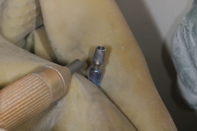 Figure 8a: Sandblasting the Ti-base.