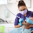 Woman Dentist Male Patient Luckybusiness