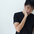 Young Man Holding Jaw