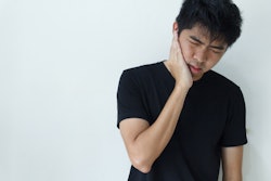 Young Man Holding Jaw