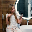 Girl Toothbrushing Smartphone Serg