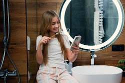Girl Toothbrushing Smartphone Serg