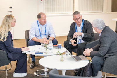 Dan Scavilla (second from left) and Aldo Denti (second from right) answer questions from DrBicuspid.com's Editor-in-Chief Kevin Henry (right).