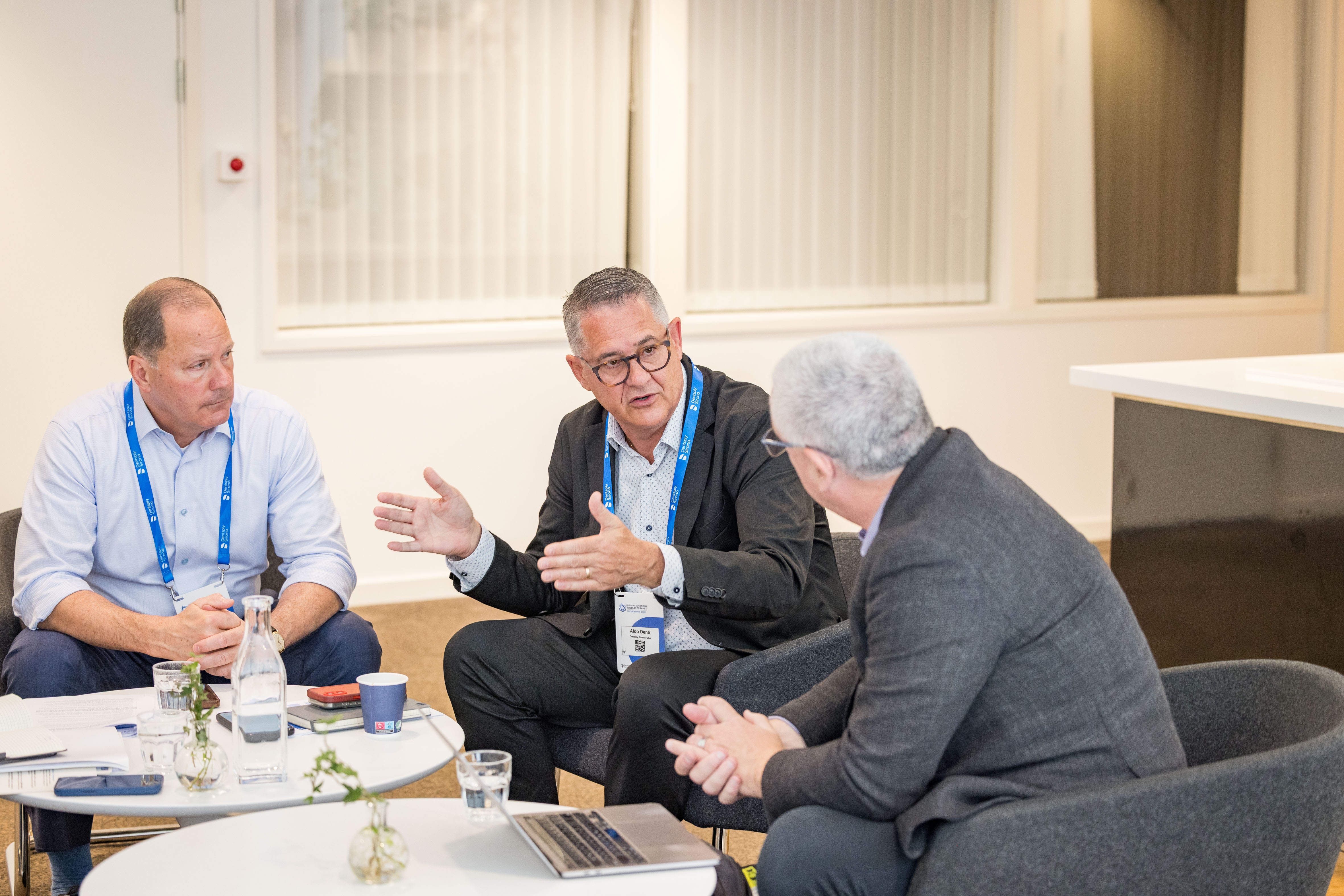 Dan Scavilla (left) and Aldo Denti (center) answer questions from DrBicuspid.com Editor-in-Chief Kevin Henry (right).