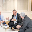 Dan Scavilla (left) and Aldo Denti (center) answer questions from DrBicuspid.com Editor-in-Chief Kevin Henry (right).