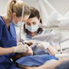 Dentist And Assistant