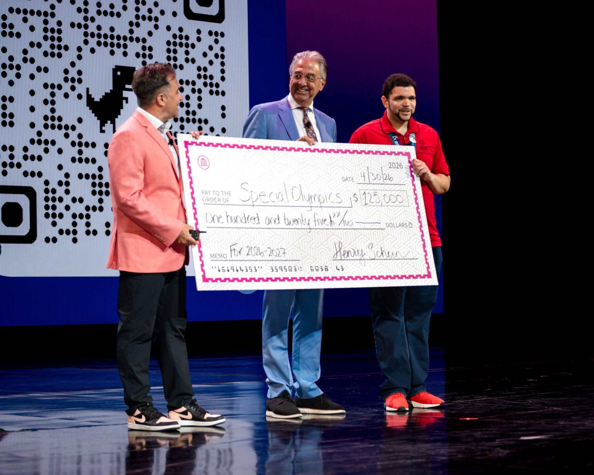Special Olympics' Chief Health Officer Dr. Dimitri Christakis (center) and Special Olympics Nevada athlete Paul Brooks Jr. (right) at the Thrive Live conference in Las Vegas, where Henry Schein renewed its partnership with Special Olympics.