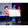 Special Olympics' Chief Health Officer Dr. Dimitri Christakis (center) and Special Olympics Nevada athlete Paul Brooks Jr. (right) at the Thrive Live conference in Las Vegas, where Henry Schein renewed its partnership with Special Olympics.