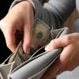 Woman Bills Purse Shutterstock New Africa