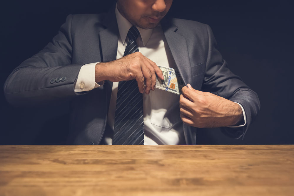 Man Stealing Bills Shutterstock Atstock Productions