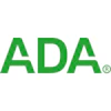 Green and white logo of the American Dental Association.