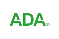 Green and white logo of the American Dental Association.
