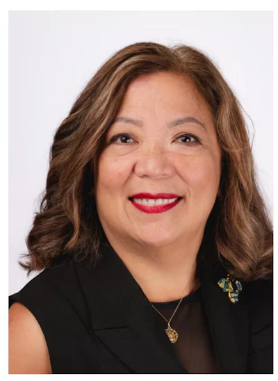 Headshot of Dr. Marie ECS Alejandrino-Buell, founder and CEO of Dental Designs.