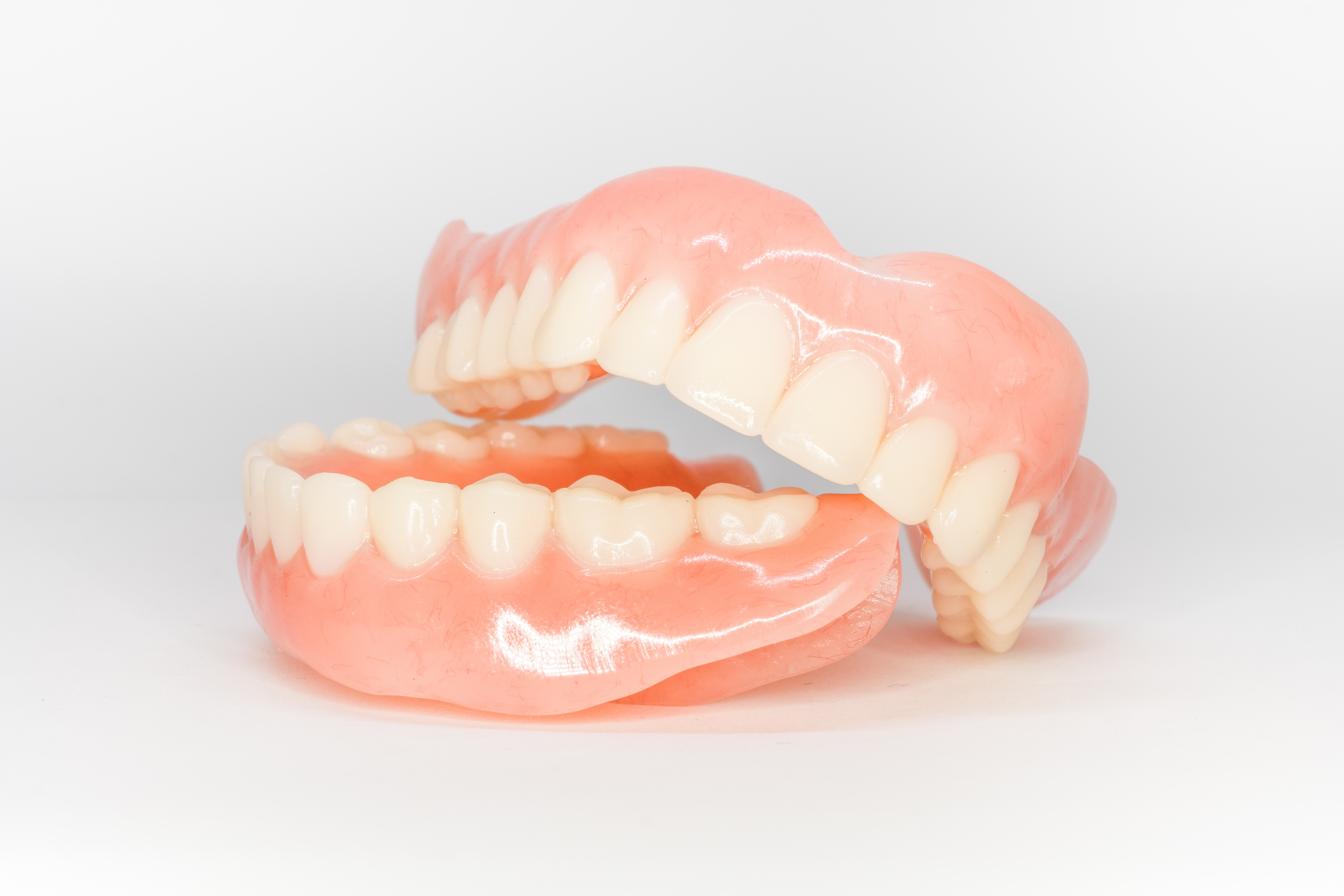Set of dentures, with the upper prosthesis resting on the mandibular prosthesis.