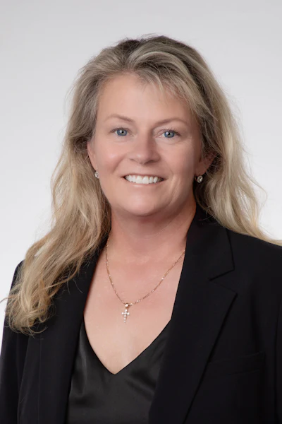 Headshot of Kim Milleman, PhD, MS, RDH, founder and CEO of Salus Research.
