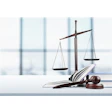 Scales of justice are pictured next to law case books and a gavel.