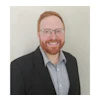 Headshot of Chris Mizenko, co-founder of Zen Dental Support.